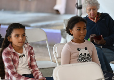 Captivated audience at storytelling tent